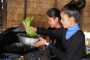 Our hosts Mom and Sam: Homemade Khmer food means for them using the morning glory they planted, grew and harvested in their backyard. 