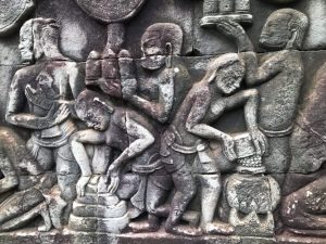 Ancient carving of cooking rice in Angkor Wat